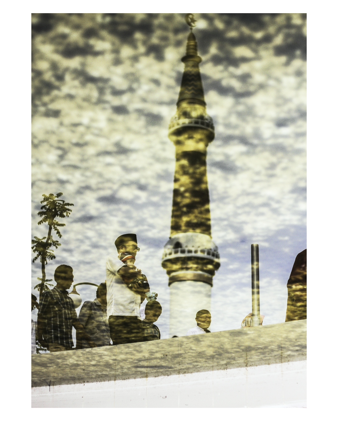 Reflection of Padang Mosque tower where the Ied Fitri pray held. Muslims worldwide celebrate Eid al-Fitr marking the end of the fasting month of Ramadan. Taken on June 15, 2018. Photo : IG @tanharimage