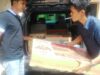 Kanit Reskrim Polsek Lubuk Basung beserta anggota saat menurunkan hasil curian dari mobil rental yang dirental oleh orang tua angkat pelaku untuk melancarkan aksinya