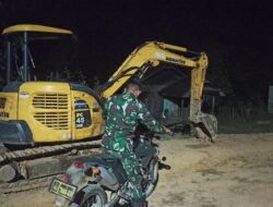 Personil Satgas TMMD 110/ Kodim 1201 Bergiliran Jaga Alat Berat