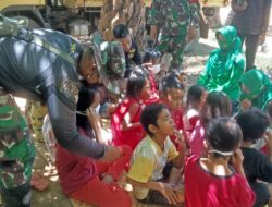 Anggota Satgas TMMD 110 Bagikan Masker ke Anak-anak Desa Tolok